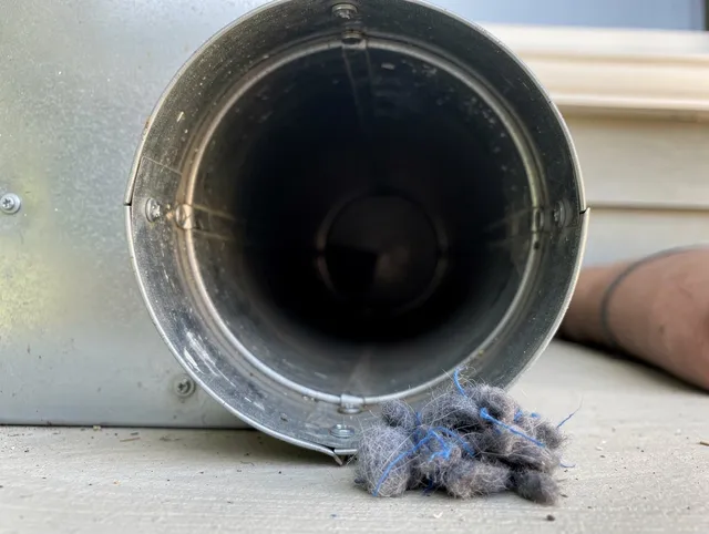 Stallings Dryer Vent Cleaning technician using specialized equipment to clear severe dryer vent blockage in Stallings